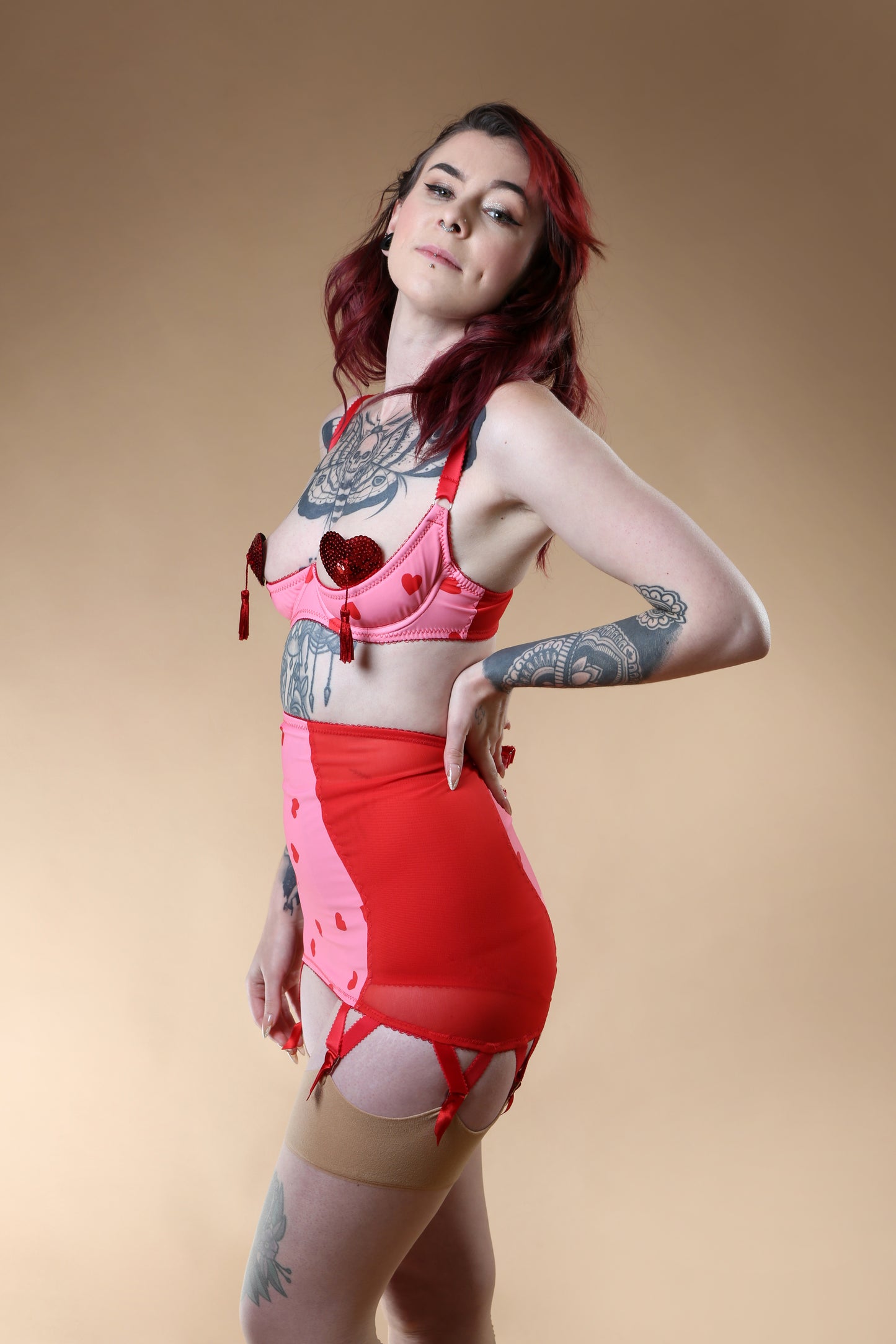 red and pink heart lingerie. vintage inspired longline girdle with pink heart front and red mesh sides, perfect for valentines cheesecake pin ups, six suspender garter clips to hold up seamed stockings. A fun, bold, playful retro inspired underwear set