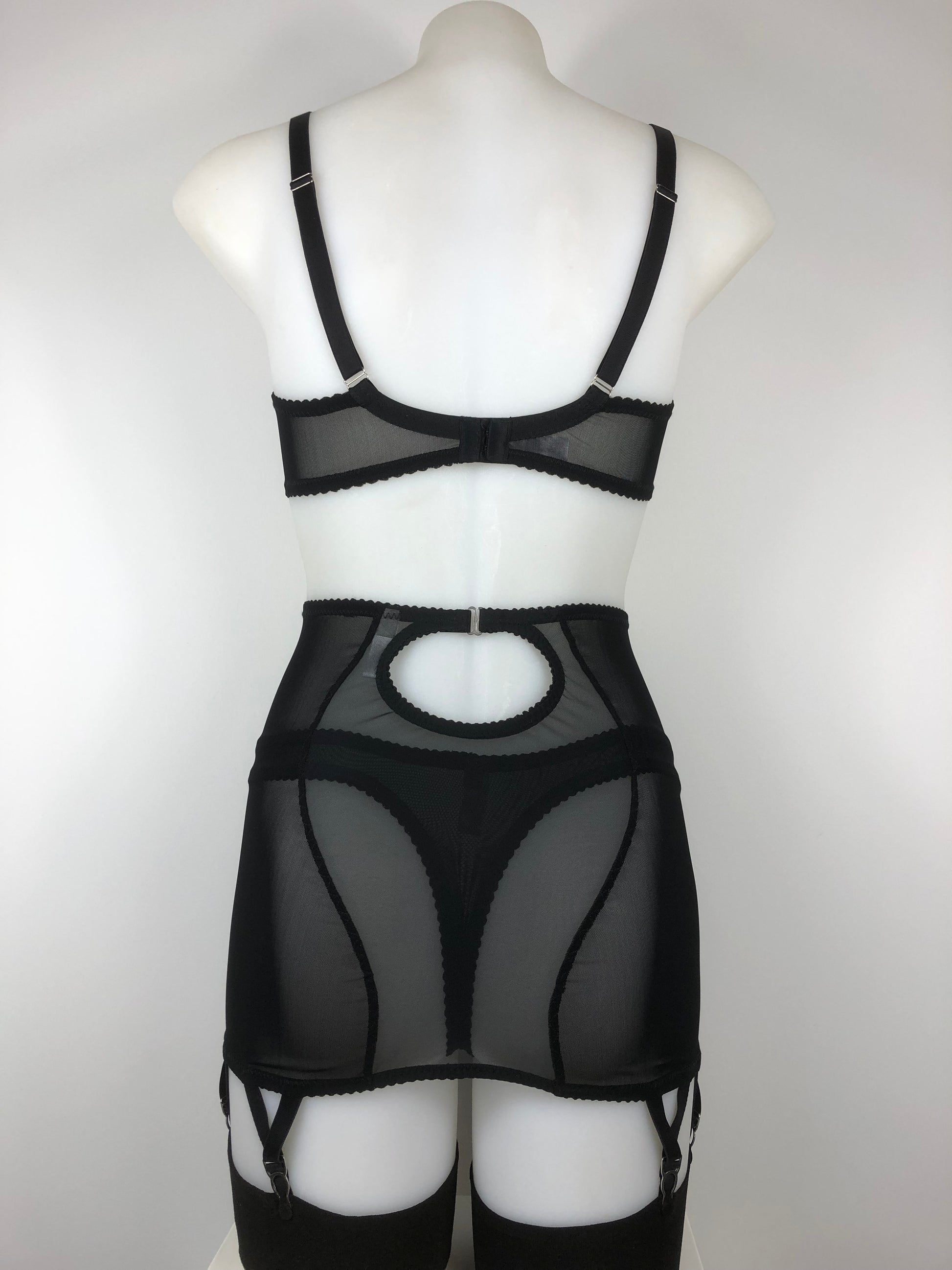 Sheer see through black mesh longline girdle with 6 suspender straps. Transparent fetish bettie page inspired lingerie underwear. Girdlette and corselette also available