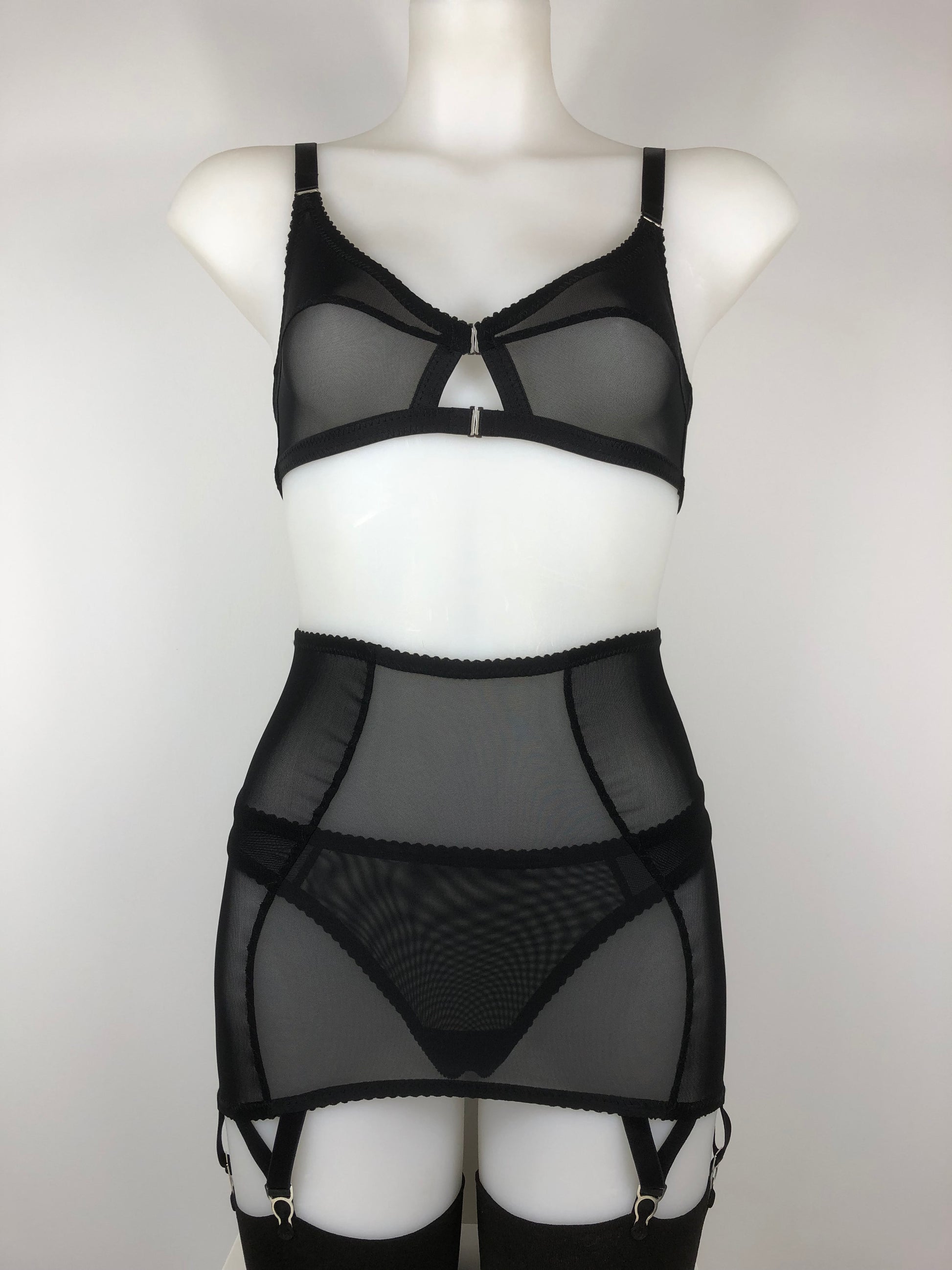 Sheer see through black mesh longline girdle with 6 suspender straps. Transparent fetish bettie page inspired lingerie underwear. Girdlette and corselette also available